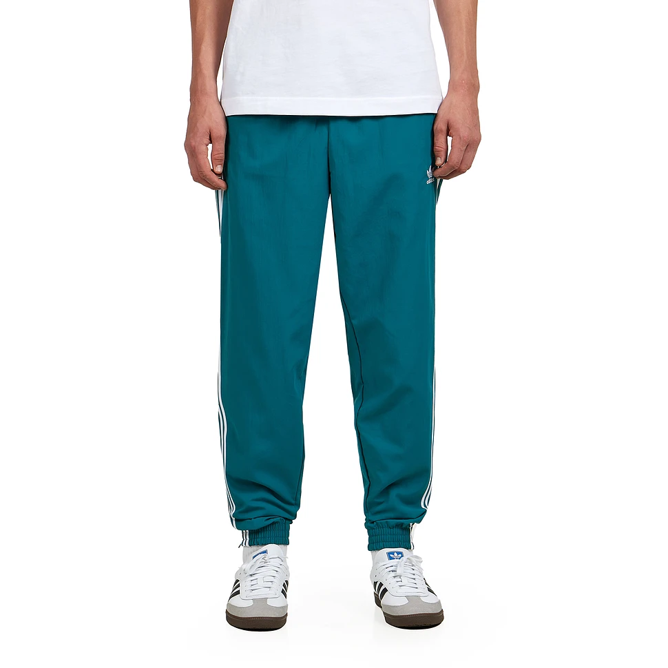 Teal adidas track pants deals